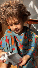 Young child in dinosaur pajamas observed in Barcelona home