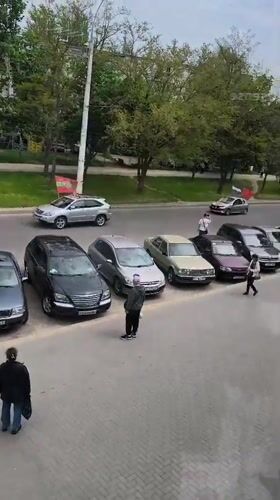 Car displays Russian flag while driving through Tiraspol street
