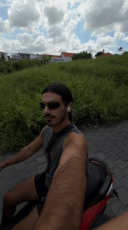 Man on red scooter filmed riding through North Kuta