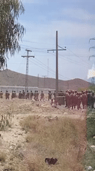 Uniformed groups spotted on dirt road in Khuzdar, Pakistan