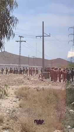 Uniformed groups spotted on dirt road in Khuzdar, Pakistan