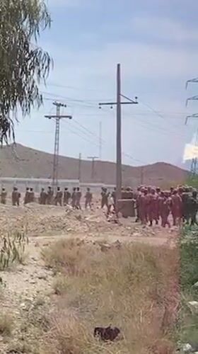 Uniformed groups spotted on dirt road in Khuzdar, Pakistan