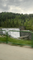 Dam waterfall observed from vehicle in Wisła, Poland