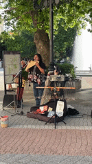 Street musician performs pan flute in Plovdiv square