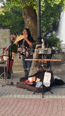Street musician performs pan flute in Plovdiv square