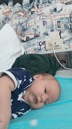 Baby in star onesie spotted during morning playtime in Andreyevo
