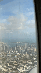 Aerial view of Miami cityscape captured from airplane window