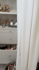 Person organizes metallic shoes and bags in LA closet