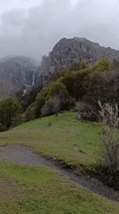 Hiker with backpack traverses mountain path near Kalofer, Bulgaria
