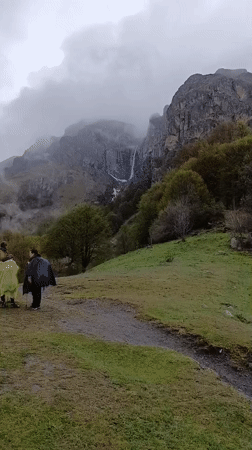 Hiker with backpack traverses mountain path near Kalofer, Bulgaria
