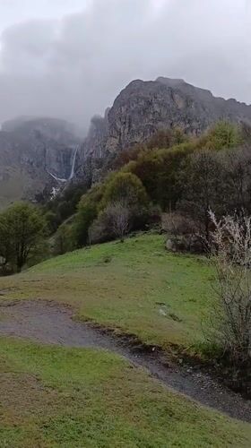 Hiker with backpack traverses mountain path near Kalofer, Bulgaria