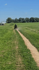 ATV trails, park paths, and apartment buildings on a sunny day
