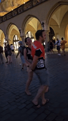 Live music and dancing fill Krakow's market square at dusk