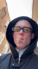 Young man films selfies while smoking near London landmarks