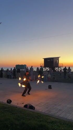 Fire performer draws crowds at sunset beach in Batumi