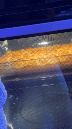 Home baker documents focaccia preparation in Ariel kitchen