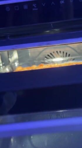 Home baker documents focaccia preparation in Ariel kitchen