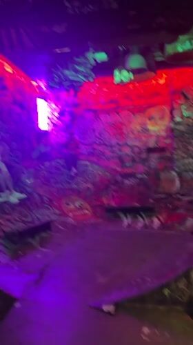 Inside a gritty, graffiti-covered Barcelona bar at night
