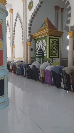 Men perform morning prayers at Itabashi City mosque