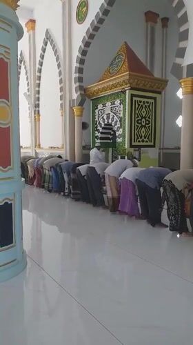 Men perform morning prayers at Itabashi City mosque