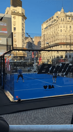 Padel tennis match played on branded court in Buenos Aires
