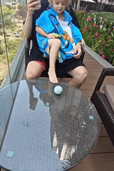 Father and child enjoy early morning swim in Mumbai rooftop pool