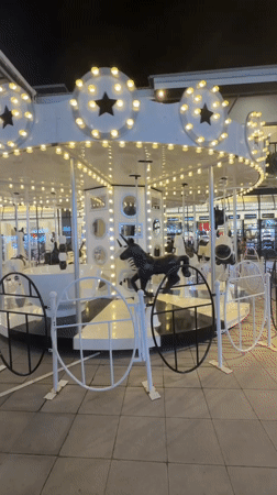 Lit-up rides and food trucks at a Ko Samui night spot