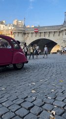 Classic cars and Parisian landmarks on a summer afternoon