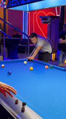 Man plays pool at billiards venue in Łódź