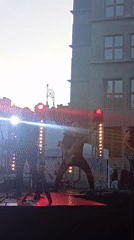 Rock band plays Wrocław's Rynek at dusk