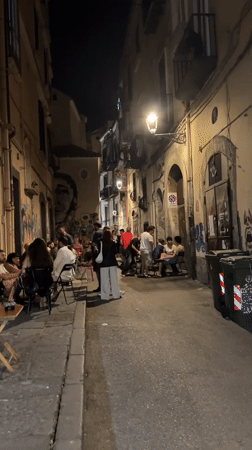 Evening dining scene with DJ entertainment in Salerno, Italy
