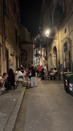 Evening dining scene with DJ entertainment in Salerno, Italy