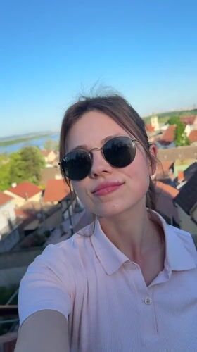 Tourist documents scenic Zemun hilltop visit with selfies, tower views