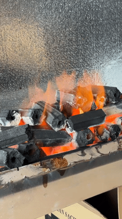 Charcoal lit and meat prepped in a Nha Trang kitchen
