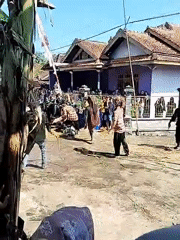 Traditional Indonesian dance performance captured in village square