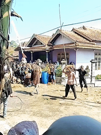 Traditional Indonesian dance performance captured in village square