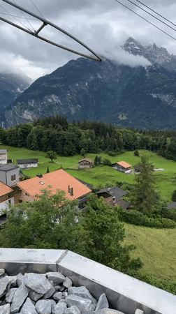 Cable car journey documents Swiss Alpine tourism scenery