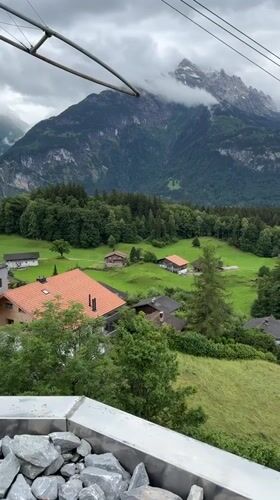 Cable car journey documents Swiss Alpine tourism scenery