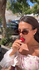Woman enjoys strawberries during morning photo session in Bodrum