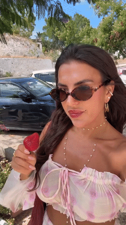 Woman enjoys strawberries during morning photo session in Bodrum