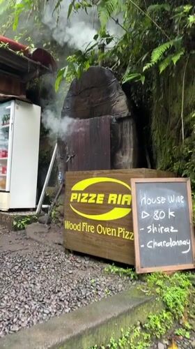 Wood-fired pizzeria oven captured smoking in Gianyar, Indonesia