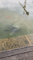 Rainbow appears over German town after storm, chair submerged