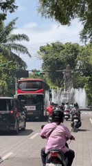Early morning street scene with balloons observed in Denpasar