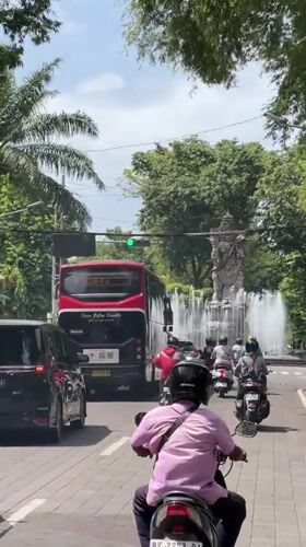 Early morning street scene with balloons observed in Denpasar