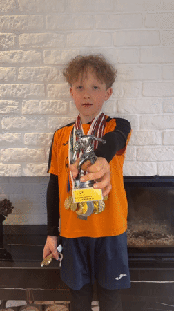 Young athlete displays medals and trophies in Carnikava