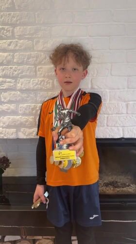 Young athlete displays medals and trophies in Carnikava