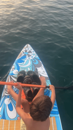 Paddleboarding and city architecture along Nha Trang's waterfront