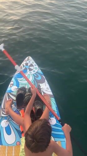 Paddleboarding and city architecture along Nha Trang's waterfront