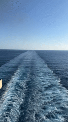 Ocean vessel creates wake during evening transit May 4