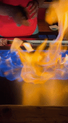 Flaming cocktails prepared during evening gathering in València, Spain